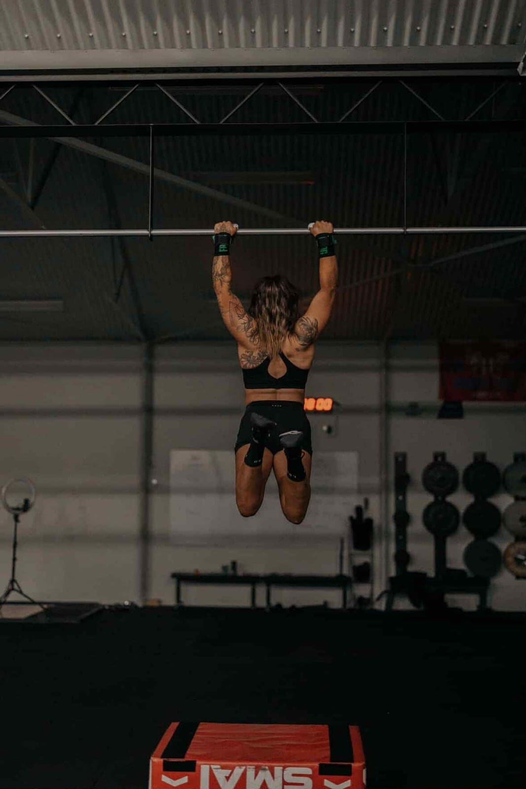 A member working through pull-ups during class at House of Hybrid.
